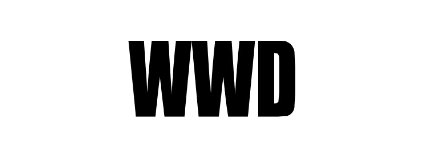 A logo of WWD (Women's Wear Daily), a leading fashion industry publication known for its coverage of fashion, beauty